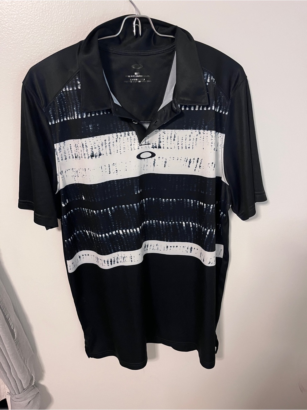 Oakley Men’s Black Polo with White Striped Graphic